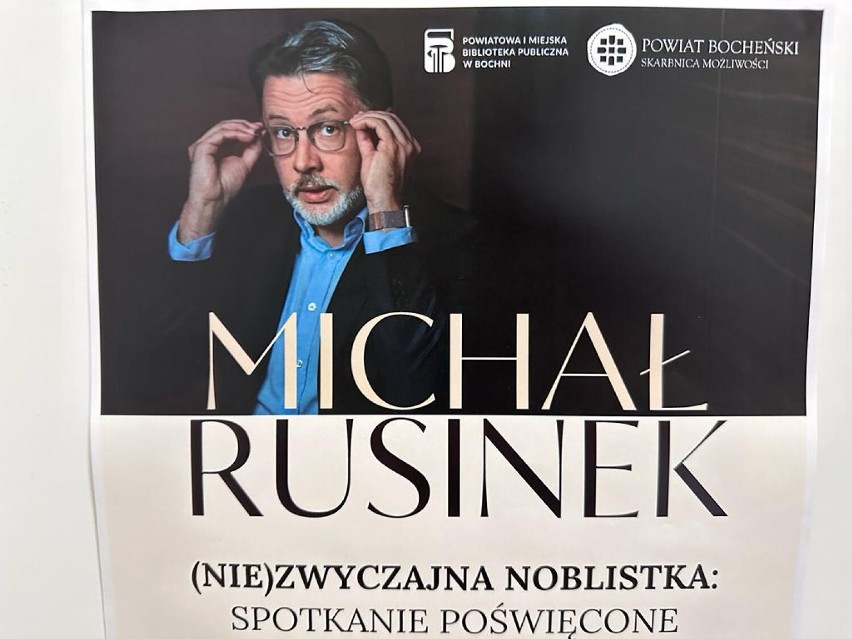 Afisz zwiastujący spotkanie z Michałem Rusinkiem w Bochni