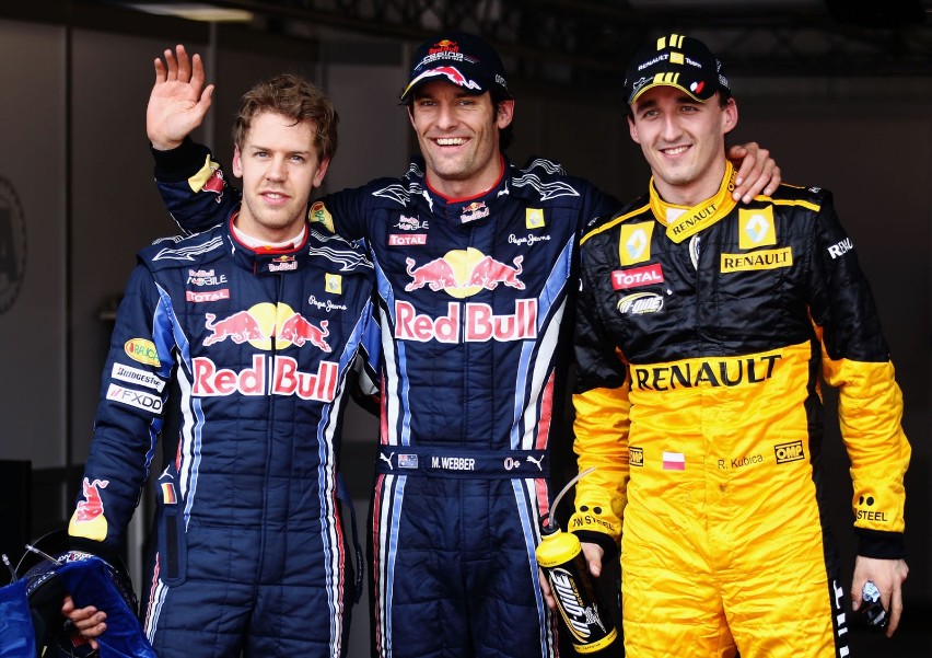 Pierwsza trójka kwalifikacji. Od lewej: Sebastian Vettel...