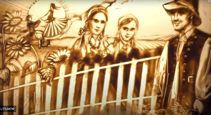 Kadr z filmu przedstawiający rysowaną piaskiem kulturę...