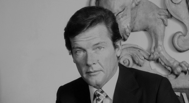 By original photo by Allan warren, CC BY-SA 3.0. Crop by Andrew Sherman (File:Sir_Roger_Moore_3.jpg) [CC BY-SA 3.0 (http://creativecommons.org/licenses/by-sa/3.0)], via Wikimedia Commons