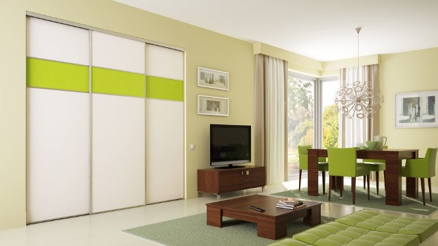System drzwi przesuwnych KomandorDrzwi przesuwne z wypełnieniem z płyty Unitek i ekoskóry w kolorze zielonym i białym.
