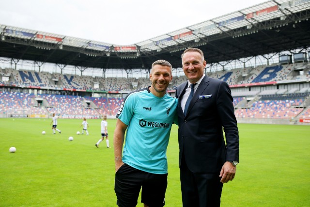 Lukas Podolski i prezes Adam Matysek