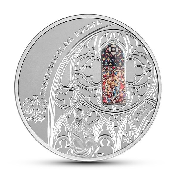Rewers monety przedstawia z prawej strony wizerunek kościoła...