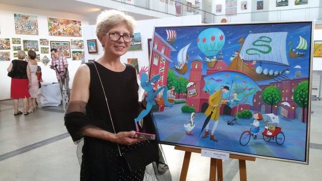 Art Naif Festiwal 2015. Iwona Lifsches z reprodukcją swojego obrazu