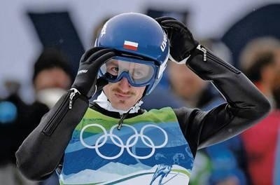 Adam Małysz po skoku na olimpijskie podium FOT. EPA/BONNY MAKAREWICZ