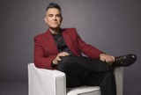 Robbie Williams w nowej kampanii zagrał z kotem Felixem. Posłuchajcie, jak sobie poradził. Internauci są zachwyceni. WIDEO