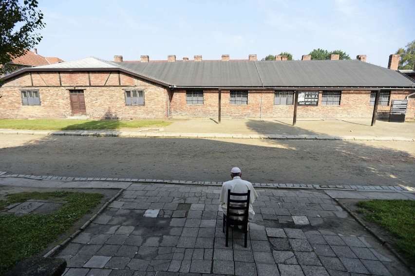 Pope francis prays during his visit to the former nazi...