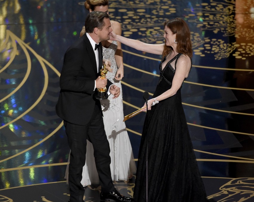 Julianne moore, right, congratulates leonardo dicaprio after...