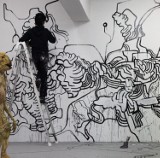 Śledź w sieci, jak artysta tworzy graffiti 