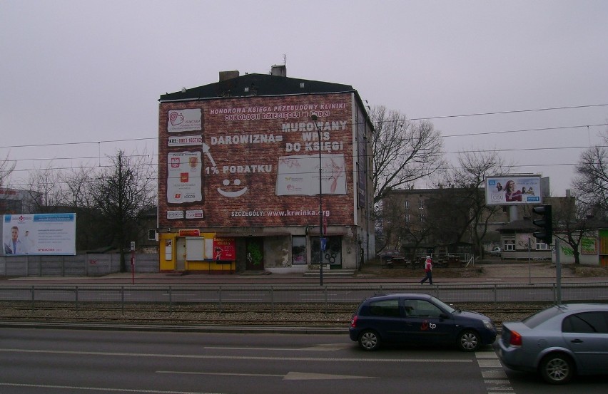Wielki billboard informacyjny przy skrzyżowaniu Zachodniej i Lutomierskiej