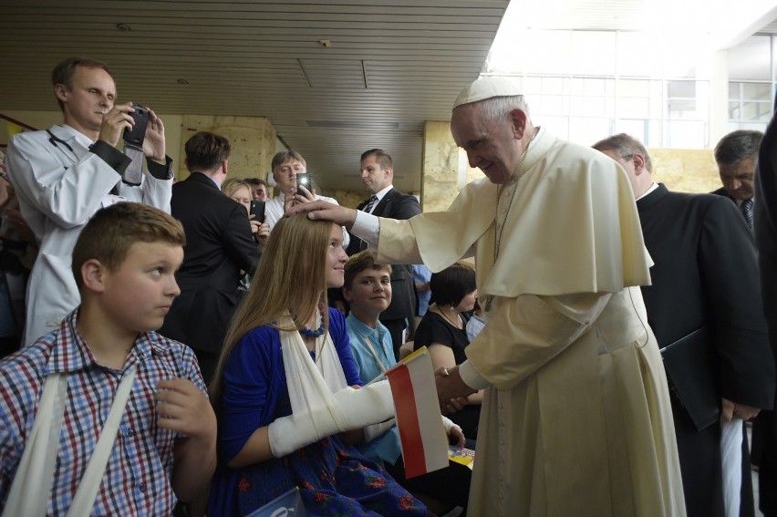 Pope francis blesses children during his visit to the...
