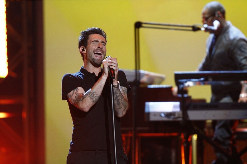 Adam levine, of the musical group maroon 5, performs at the...