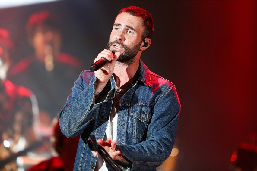 Adam levine of maroon 5 performs at the we can survive...