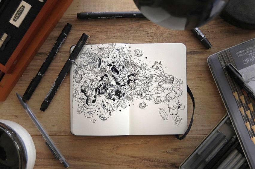 Surrealistyczne rysunki w notatniku